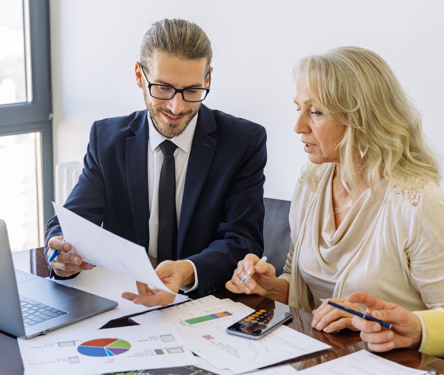 A Roadmapp PMO consultant reviewing portfolio reports with a client